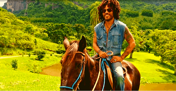 Lenny Kravitz riding a horse in his home in Brazil