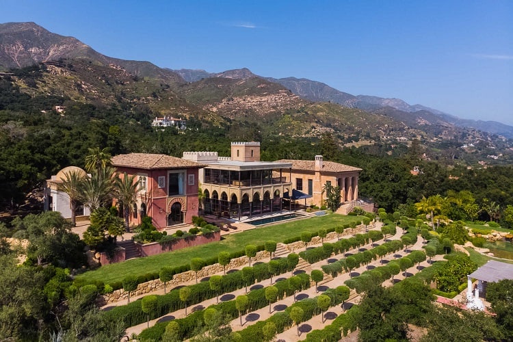 Aerial view of Scooter Braun's house in Montecito, with terraced landscaping in front and the mountains in the back