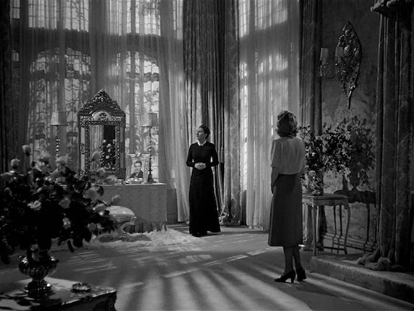 Mrs Danvers and the new lady of the house in Rebecca's bedroom