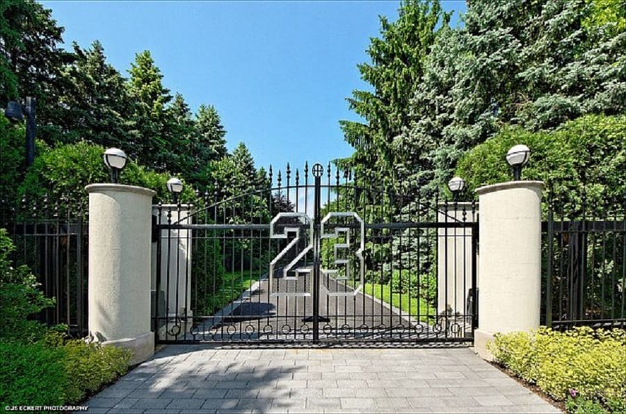 The entrance to Michael Jordan's house is marked by a personalized gate showing his jersey number, 23.