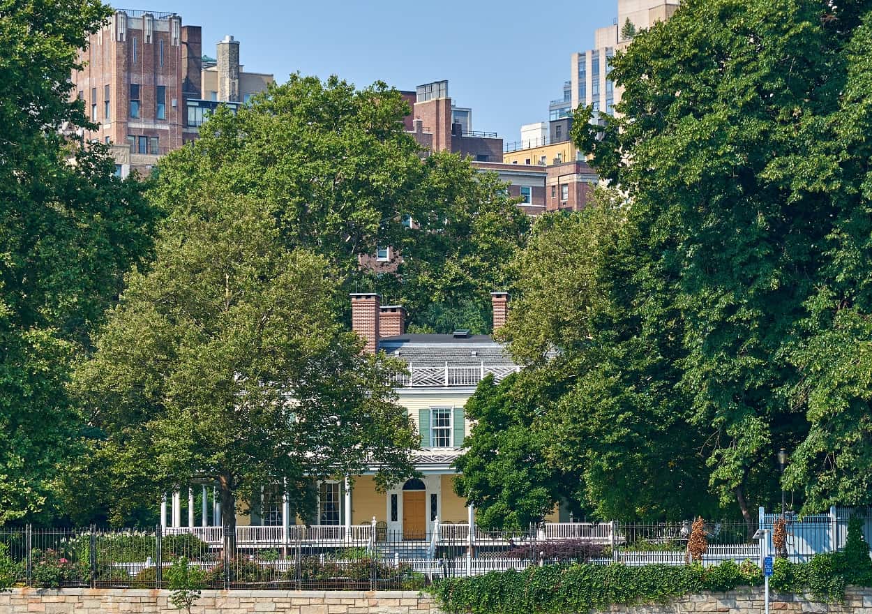 view of Gracie Mansion in NYC, partially covered by trees