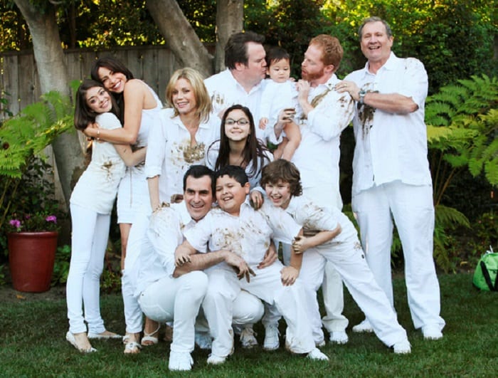 the entire cast of Modern Family tv show, all dressed in white