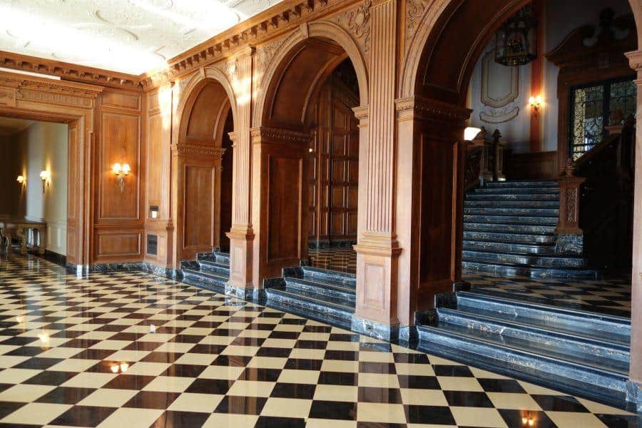 The grand hall and staircase at Greystone Mansion