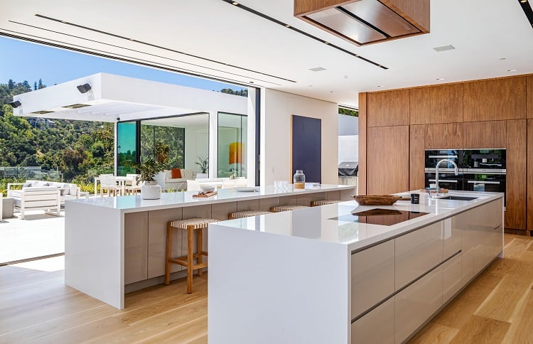 modern kitchen with sliding glass doors and an oversized eat-in island