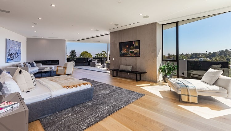 The master bedroom in Chrissy Teigen and John Legend's house opens up to stunning views. 