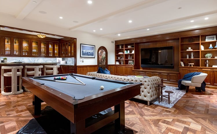 Entertainment room of an ultra-luxurious villa on N. Roxbury Drive. 