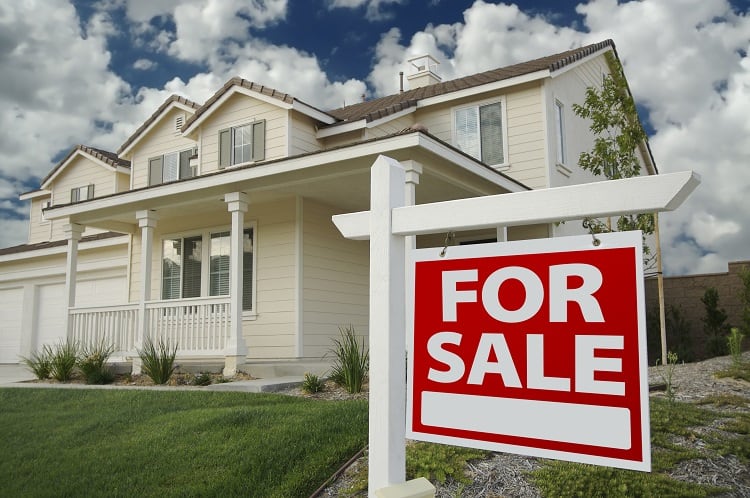 house for sale with sign in front