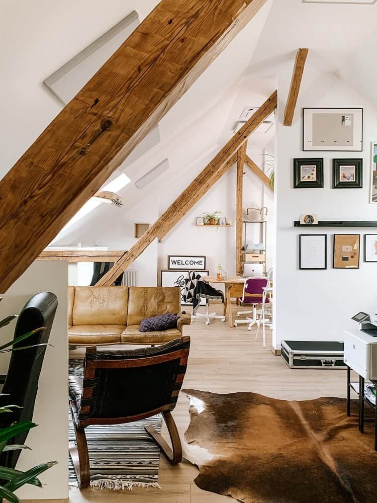 attic living space with exposed beams