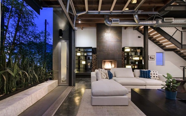 Modern loft in Venice, CA has a unique pull-up garage door window that opens to the outdoors