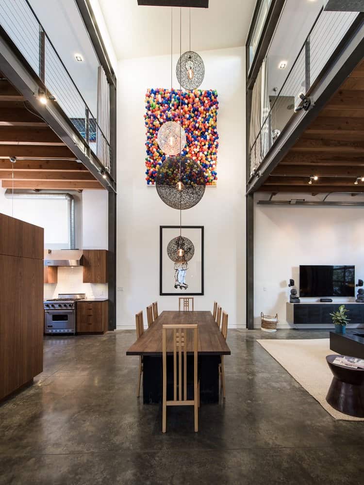 two-story art wall right in the middle of a loft