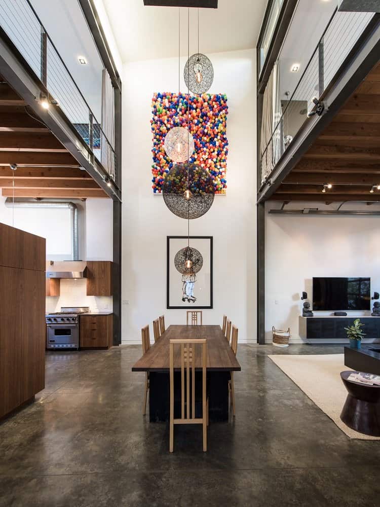 two-story art wall right in the middle of a loft 