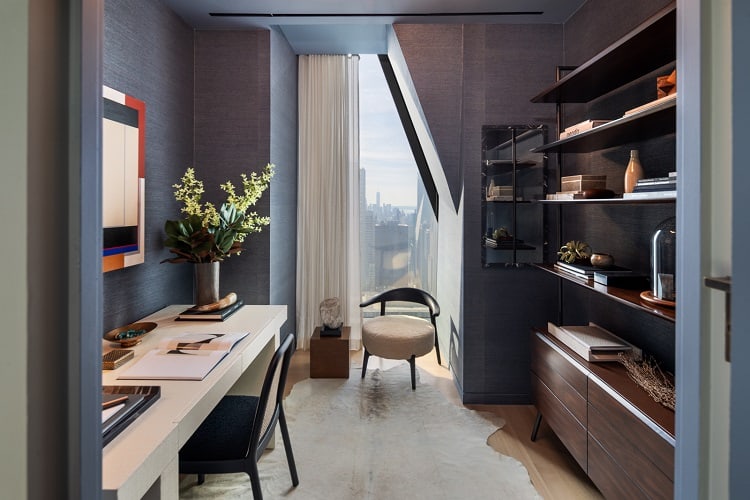 The home office dons rich silvered blue wall and elegant furnishings. Image credit: Evan Joseph