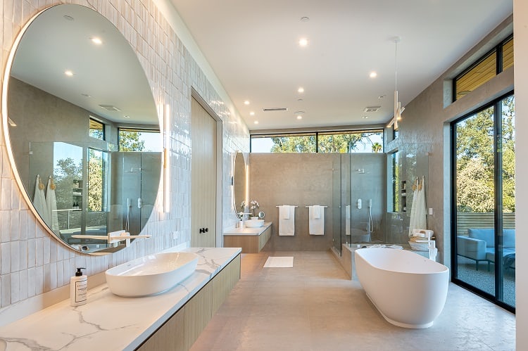 luxurious master bathroom with floor-to-ceiling limestone