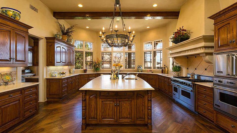 the kitchen in Britney Spears' house, with dark wood cabinets and a large center island