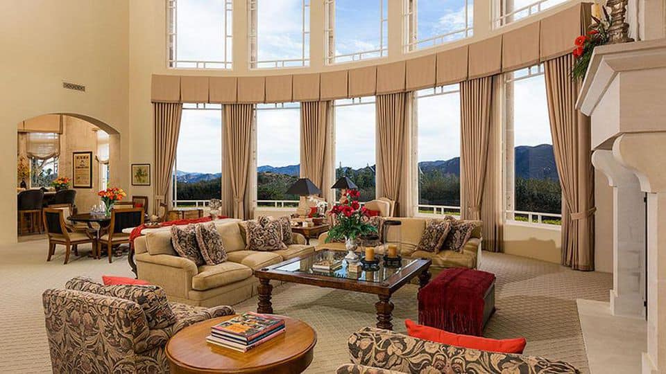 living room with extra tall ceilings and two rows of windows inside Britney Spears' house in Thousand Oaks, California