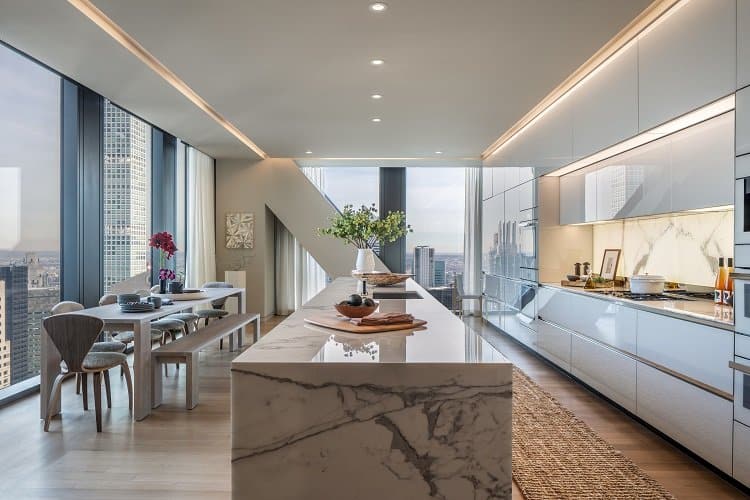 Luxurious kitchen with marble countertops and custom cabinetry. Image credit: Evan Joseph