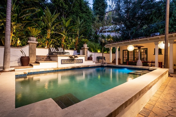 the beautiful pool area of the spanish villa