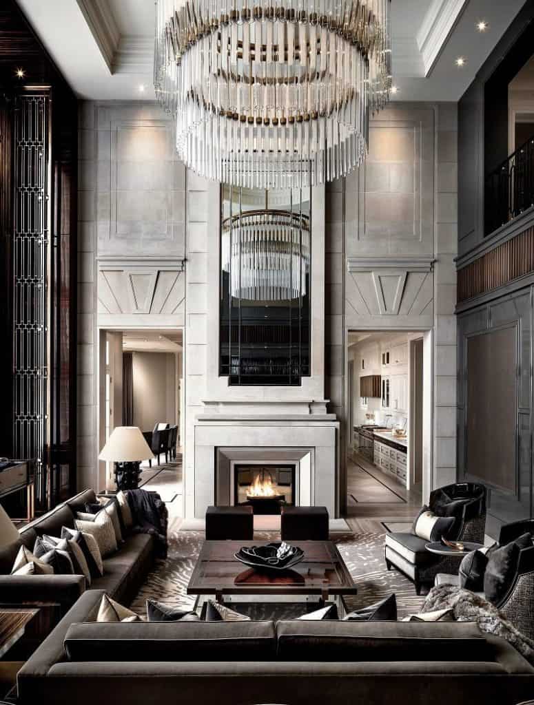 Inside Drake's mansion in Toronto, where a roaring fireplace anchors the luxurious living room. 