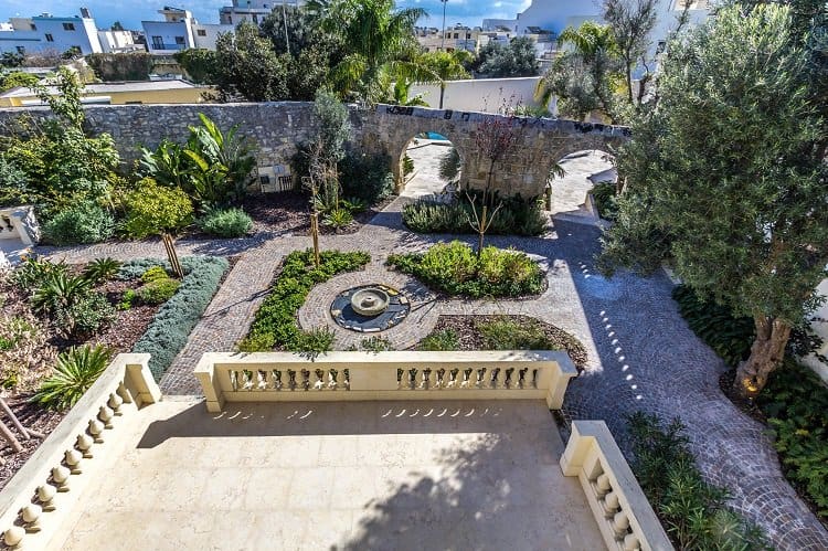 manicured gardens of a maltese palazzo