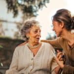 daughter visiting her mother in a senior living community