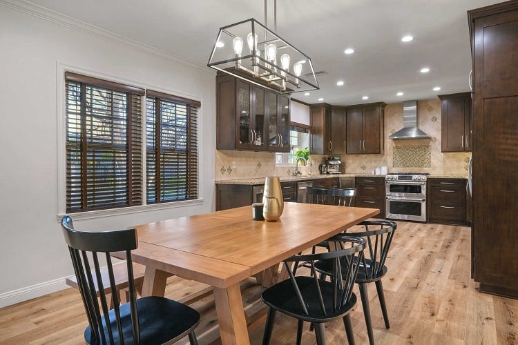 renovated kitchen with dark cabinets 