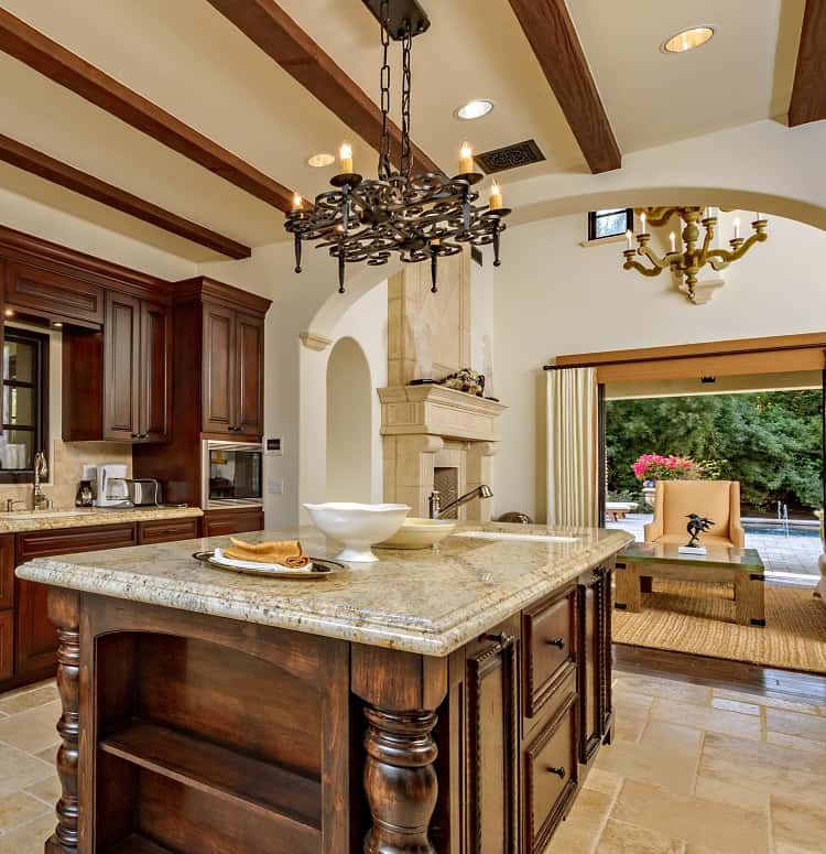 sylvester stallone's kitchen with dark wood and intricate carvings