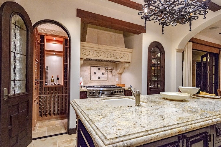 sylvester stallone's kitchen with dark wood and intricate carvings