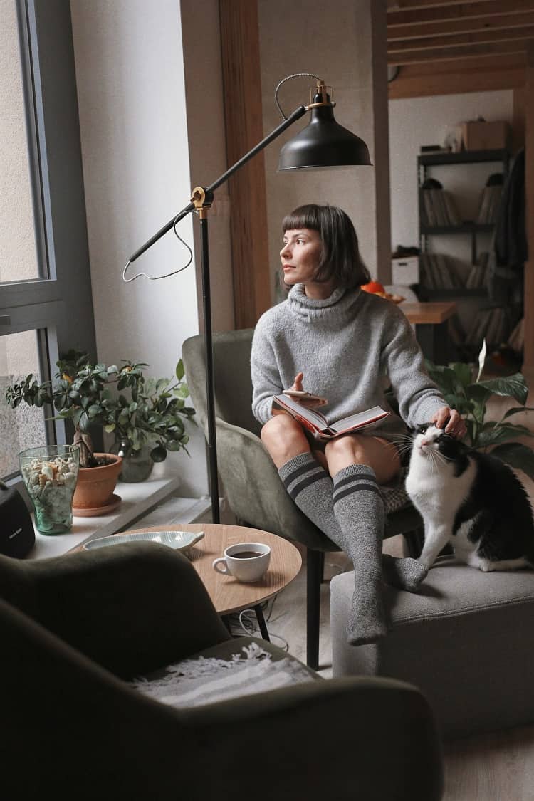 woman at home with her cat 