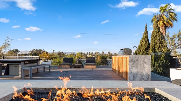 The rooftop deck has expansive fire pit, and plenty of room to lounge and entertain.