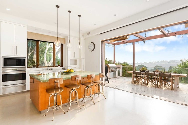 kitchen with large sliding doors that open up to the outdoor entertaining area