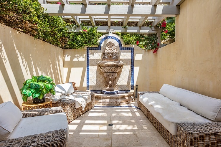 outdoor lounging area of a mediterranean-style villa in malibu