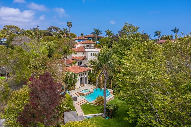 beautiful mediterranean villa surrounded by lush greenery