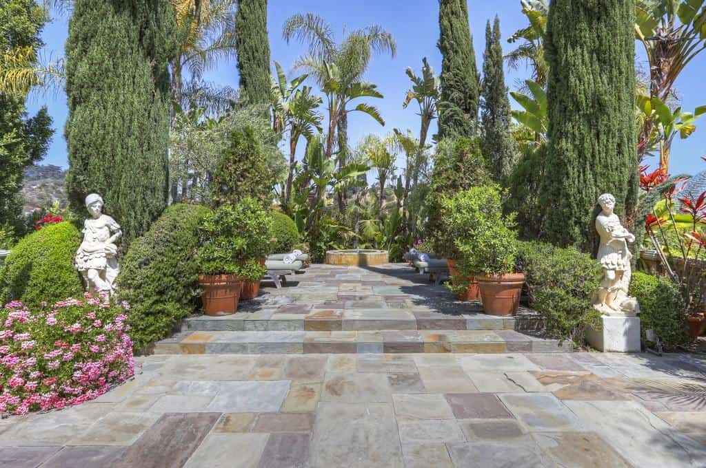 dream garden with sculptures and stone pathway