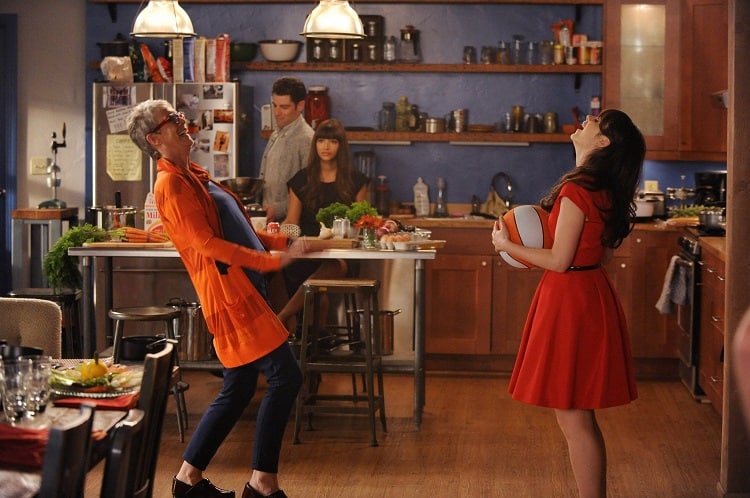 characters from The New Girl laughing in the beautiful kitchen of the loft