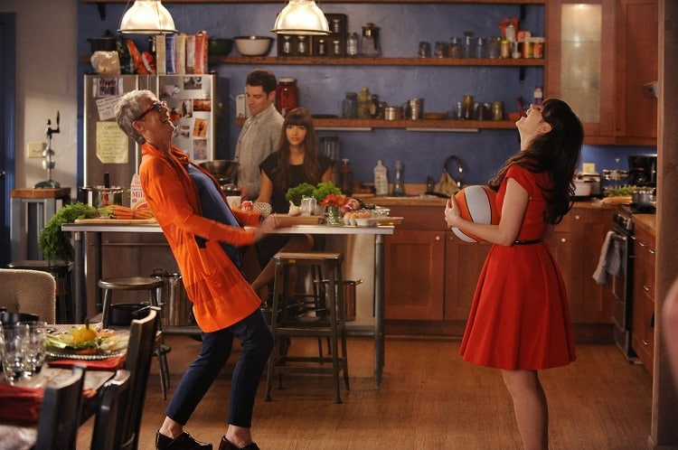 characters from The New Girl laughing in the beautiful kitchen of the loft 