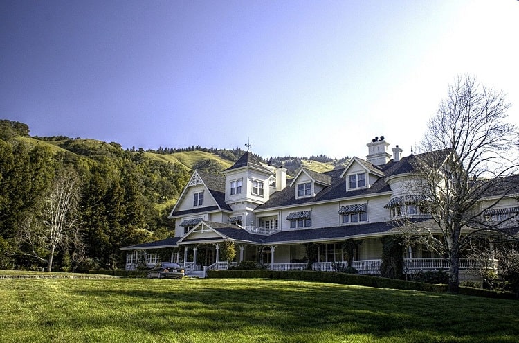 The main house at Skywalker Ranch with Victorian architecture and a large green lawn