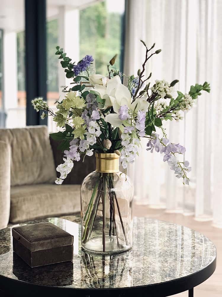 fresh flower arrangement on coffee table  