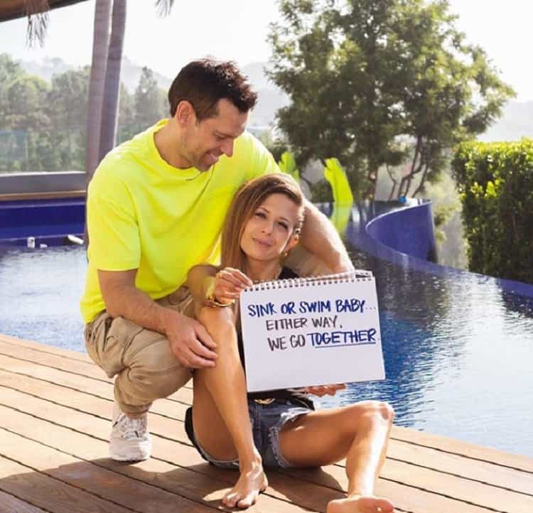 Lisa and Tom Bilyeu photo taken next to their wrap-around pool.