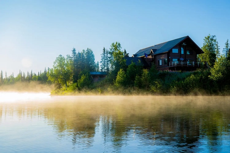 mountain lodge on a lake in an idyllic setting