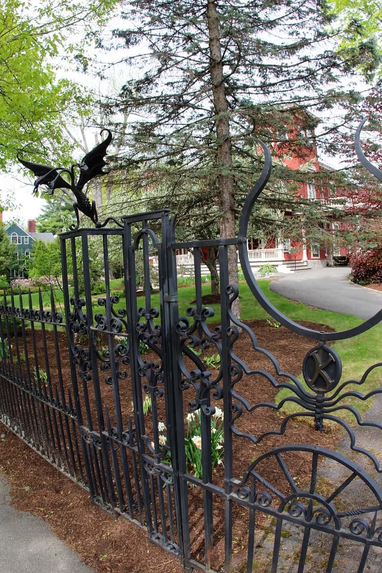 Wrought iron creatures ornate the fence in front of Stephen King's house in Bangor, Maine. 