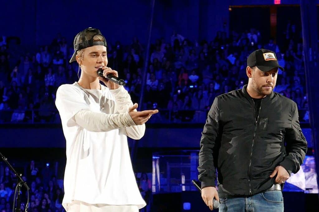 Scooter Braun on stage with Justin Bieber during a concert in Rosemont, Illinois.