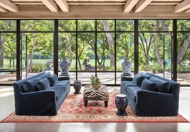 living room with floor-to-ceiling walls of glass inside Joe Rogan's house in Austin, TX