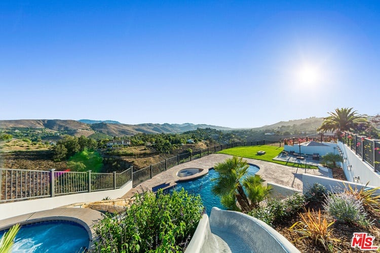 The pool area offers stunning views of the valley.