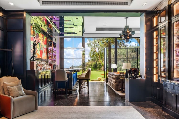 bar with glass wall inside Adele's house