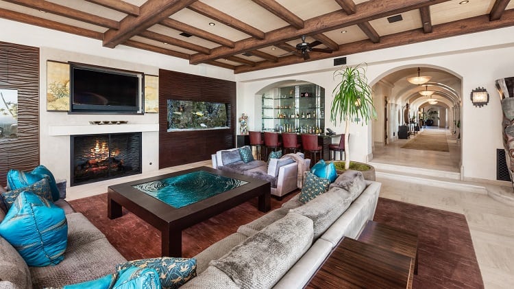 Luxury living room with fireplace inside Jeff Franklin's house, currently on the market asking $85 million.
