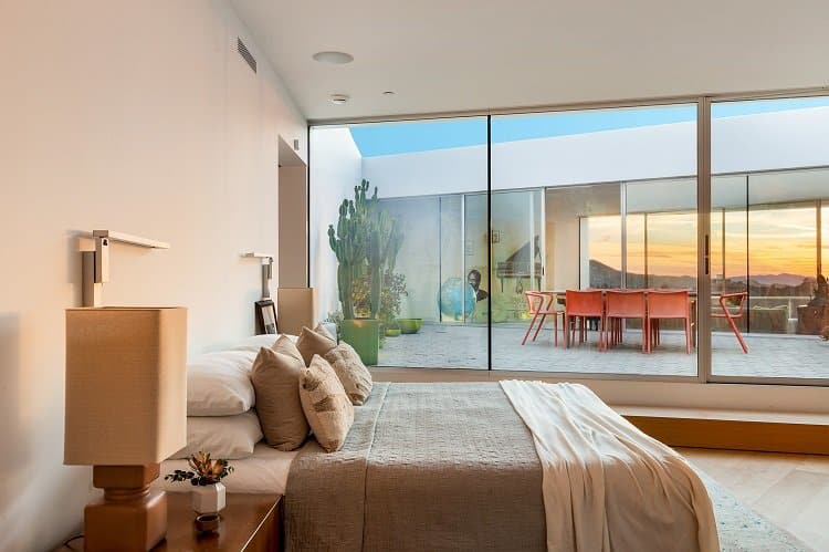 modern bedroom with glass walls in bassist Flea's house