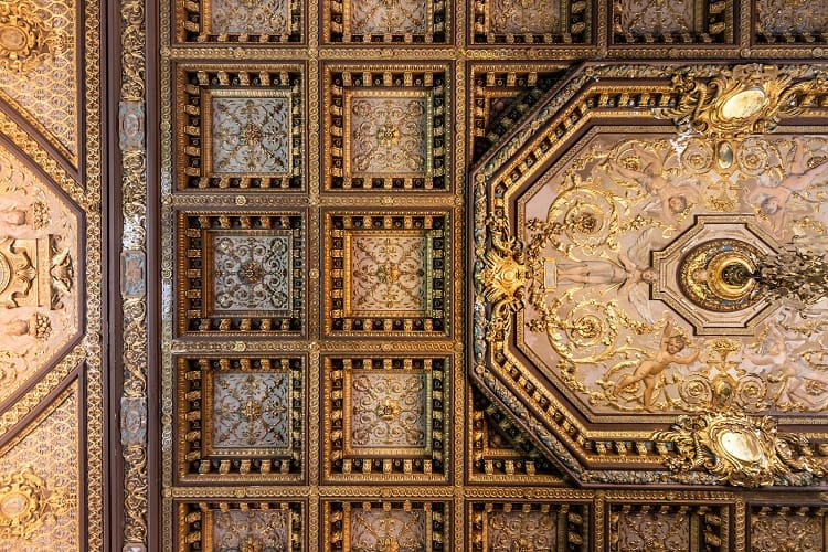 Coffered ceilings with intricate gold details at Winfield Hall.