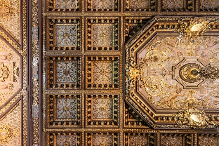 Coffered ceilings with intricate gold details at Winfield Hall. 