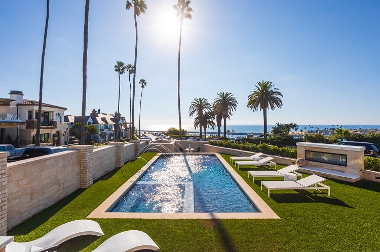 pool and palm trees in the backyard of the Island House in Corona del Mar