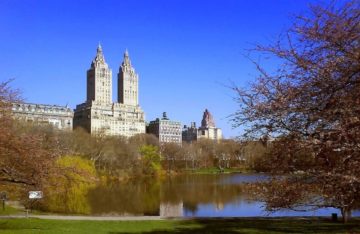 The San Remo building in New York City, with Central Park and a lake in front